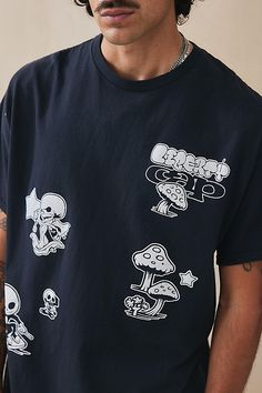 Skate-ready graphic tee. Cut from cotton jersey featuring a crewneck, drop shoulders, short sleeves and a boxy fit. Complete with shroom and skull graphics. Content + Care 100% Cotton Machine wash Imported Size + Fit Model is 185cm/6'1" and wearing size Medium Use our size guide to check how this product fits | Urban Outfitters UO Mushroom Tee in Black, Men's at Urban Outfitters Urban Outfitters Streetwear T-shirt With Screen Print, Urban Outfitters Graphic Tee For Streetwear, Urban Outfitters Cotton Graphic Print T-shirt, Urban Outfitters Short Sleeve T-shirt For Streetwear, Urban Outfitters Casual T-shirt For Streetwear, Casual Urban Outfitters T-shirt For Streetwear, Urban Outfitters Graphic Print Tops For Streetwear, Black Graphic Tee With Mushroom Print, Black Crew Neck T-shirt With Mushroom Print