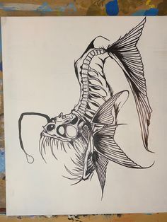 a black and white drawing of a fish