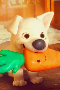 a white dog holding a toy carrot in it's mouth