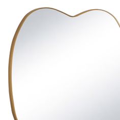 a heart shaped mirror on a white background