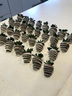 several chocolate covered strawberries arranged in the shape of a heart on a counter top