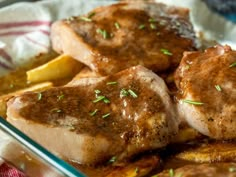 some meat and potatoes are in a glass dish