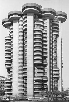 a tall building with many balconies on the top of it's sides