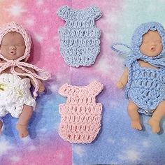 three crocheted baby dolls laying next to each other on a pink and blue background