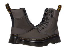 Dr. Martens Tarik - Shoes : Gunmetal Extra Tough 50/50/Ajax : An iconic combat boot silhouette, the Dr. Martens Tarik boots pair easily with your favorite denim and feature a genuine leather upper. Tall, lace up boot with pull tab at heel and round toe. Textile lining and insole. Durable synthetic outsole. Imported. Measurements: Heel Height: 1 1 2 in Weight: 1 lb 14 oz Platform Height: 8 in Product measurements were taken using size UK 8 (US Men's 9, US Women's 10), width Medium. Please note th Rugged Insulated Lace-up Combat Boots, Fall Outdoor Lace-up Boots With Reinforced Heel, Streetwear High Ankle Lace-up Boots With Reinforced Toe, Fall Hiking Combat Boots With Reinforced Toe, Insulated Lace-up Combat Boots For Hiking, Lug Sole Ankle Combat Boots For Hiking, Fall Combat Boots With Reinforced Heel And Lace-up, Lace-up Moto Boots For Outdoor Work In Fall, Fall Outdoor Work Lace-up Moto Boots