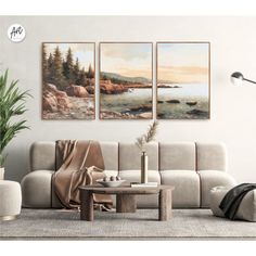 a living room with three paintings on the wall