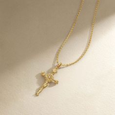 The November feature in our "Floral Cross Collection" is the Sunflower Cross Pendant, an embodiment of positivity, loyalty, and worship. This exquisitely crafted pendant merges the radiance of sunflowers with the sacredness of the cross, symbolizing the believer's devotion to looking towards the light of God, much like the sunflower gazes upon the sun. Sunflowers in Christian symbolism are renowned for representing worship and loyalty, qualities deeply etched within the folds of this design. Ado Spiritual Clavicle Chain Cross Pendant Necklace, Spiritual Cross Necklace With Adjustable Chain, Spiritual Crucifix Clavicle Chain Jewelry, Spiritual Yellow Gold Cross Necklace, Spiritual Necklace With Cross Pendant For Blessing, Spiritual Cross Pendant Necklace For Blessing, Gold Cross Amulet Necklace, Spiritual Yellow Gold Crucifix Necklace, Yellow Gold Crucifix Necklace Spiritual