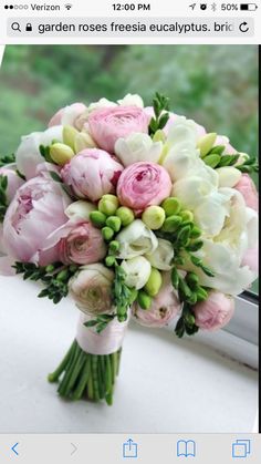 a bouquet of flowers sitting on top of a window sill