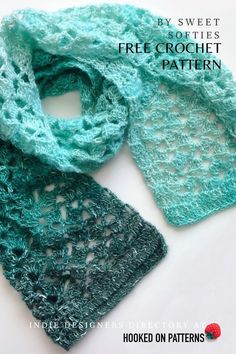 two crocheted scarves sitting next to each other