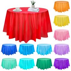 various colors of plastic table cloths on top of a round table with plates and cups