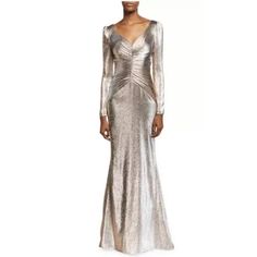 Brand New Size 14 $995 This Shimmering Metallic Lam Gown Boasts A Flattering Ruched Bodice. Sweetheart Neckline Long Puff Sleeves Concealed Back Zip Ruched Bodice Metallic Lam Finish Stretch Lining Nylon/Polyester/Silk Dry Clean Imported Size & Fit Fit-And-Flare Silhouette About 63'' From Shoulder To Hem Our Products Are 100% Genuine. We Stand By The Authenticity Of Every Product Sold. Our Clothing, Handbags, Shoes Have A Black Or Red Line Strikethrough Label To Prevent Store Returns. If You Hav Long Sleeve Gold Dress, V Neck Gown, Womens Evening Gowns, Theia Dresses, Couture Beading, Evening Dress Floor Length, Designer Evening Gowns, Top Design Fashion, Dress The Population