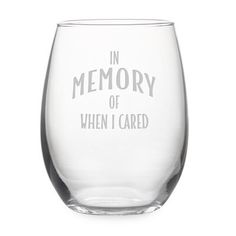 an empty wine glass with the words in memory of when i cared it, on a white background