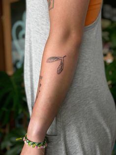 a woman with a tattoo on her arm