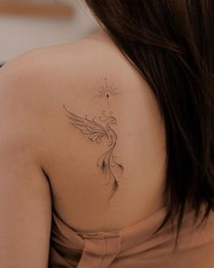 a woman with a tattoo on her back