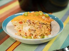 a piece of casserole on a blue and white plate