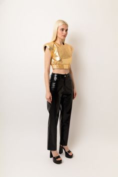 High waist faux leather trousers in metallic finish. Straight leg fit. Structured waistband with belt loops and 4 functional pockets.  Exposed button and concealed zip-fly fastening. 50% Polyester, 50% Polyurethane Hand wash Metallic Leather Pants For Night Out, Gold High-waisted Pants For Workwear, Gold High-waisted Pants For Work, Shiny Straight Leg Leather Pants For Party, Gold High Waist Pants For Workwear, Gold High Waist Pants For Work, Chic Shiny Leather Pants For Night Out, Chic Metallic Straight Leg Leather Pants, Metallic Straight Leg Leather Pants For Night Out