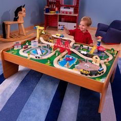 a kid playing with a toy train set and table just $ 79 99 today only