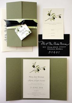 wedding stationery with olives and black ribbon on the front, green pocketfold