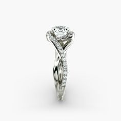 a white gold ring with diamonds on the sides and a twisty band around it