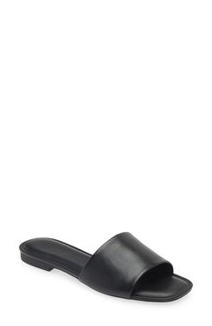 A single wide strap sweeps across the top of this simple and always-essential slide sandal. Leather upper/synthetic lining/rubber sole Imported Classic Synthetic Slides, Classic Slide Mules With Cushioned Footbed, Classic Synthetic Sandals, Classic Beach Slides With Flat Heel, Classic Spring Slide Slides, Classic Textured Open Toe Slides, Classic Slip-on Synthetic Slides, Classic Synthetic Slip-on Slides, Sleek Open Toe Slides