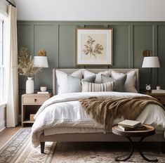 a bedroom with green walls and white bedding