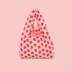 Ditch the bulky bags and opt for our Strawberry Foldable Nylon Tote - perfect for impromptu shopping sprees (or avoiding plastic bag fees)! It's compact (15" x 18.5") and 100% washable, with sturdy 9" handles for easy carrying. Inexpensive Rectangular Bag With Strawberry Print, Pantry Decor, Kitchen Candles, Nylon Tote, Face Men, New Launch, Shopping Spree, Hat Hairstyles, Plastic Bag