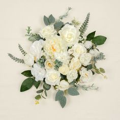 a bouquet of white flowers and greenery