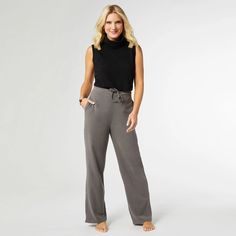 Indulge your senses with our Smooth Wide Leg Pant. Experience the luxuriously soft touch of its fabric, perfectly complemented by the gentle stretch for a perfect fit. The elastic back and smooth front offer optimal comfort, while the tie waistband and practical pockets add functionality and style. The everstretch line is a personal favorite of store staff! Polyester/Spandex See size chart in product photos Poncho Jacket, Cute Quilts, Lounge Top, Back Jewelry, Wide Leg Pant, Pocket Leggings, Sweaters And Jeans, Tote Backpack, Bag Straps