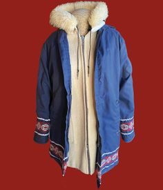 "This is an incredibly RARE Montmac Aristrocrat Sportswear jacket. The jacket is a 2 for! The wool jacket is hooded with faux fur, pockets, and just great vintage wool that would remind you of a warm Hudson Bay blanket(see my listings for several), it is lined and has side pockets. BUT, wait there is more! There is a raincoat that goes over the wool jacket! SO, if it's a cold and chilly rain, you would stay nice and warm and not wet! The raincoat piece is navy blue with a string closure hood, si Retro Winter Outerwear With Faux Fur Trim, Hooded Wool Winter Outerwear, Wool Hooded Outerwear With Drawstring, Winter Parka With Double-lined Hood, Wool Hooded Outerwear For Outdoor, Hooded Wool Outerwear For Outdoor, Cold Weather Wool Outerwear With Double-lined Hood, Wool Outerwear With Double-lined Hood For Cold Weather, Wool Hooded Jacket For Winter