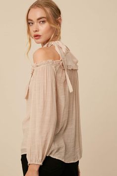 Show your springtime spirit with this darling cold shoulder blouse💐 -Color: Champagne -Linen textured -Halter neck -Cold shoulder with long puff sleeves -Elasticized on sleeve opening -Tie strap on neck -Chiffon contrast on chest and back -Ruffle on chest -Model is 5' 10" 33-24-35 and wearing a size Small Spring Off-shoulder Top With Blouson Sleeves, Fall Brunch Off-shoulder Top, Spring Blouse With Balloon Tie Sleeves, Long Sleeve Blouse With Elastic Shoulders For Summer, Spring Long Sleeve Off-shoulder Top With Elastic Shoulders, Fall Off-shoulder Blouse With Blouson Sleeves, Spring Off-shoulder Long Sleeve Top, Chic Spring Off-shoulder Top With Blouson Sleeves, Chic Spring Off-shoulder Top With Long Sleeves