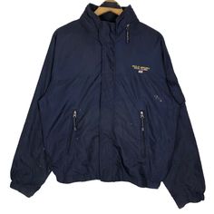 Vintage Polo Sport Ralph Lauren windbreaker jacket in navy blue colour. Full zip nylon jacket with foldable hoodie. Still in good condition EXCEPT some paint stains on the jacket. SEE THE PICTURES FOR MORE DETAILS. CONDITION : 7/10 MEASUREMENT Pit : 23.5 inch Length : 26 inch Shoulder : - Sleeve : 32 inch Size On Tag : L Recommended Size : L PAYMENT We accept PayPal only. The item will be ship 3-5 days once the payment has been made. NORMAL SHIPPING FEDEX USUALLY AROUND 7-21 DAYS BEFORE REACH TH Navy Nylon Windbreaker For Outdoor Activities, Navy Windbreaker With Detachable Hood For Winter, Navy Windbreaker For Winter Outdoor Activities, Navy Windbreaker For Outdoor Winter Use, Navy Winter Windbreaker For Outdoor Activities, Navy Long Sleeve Hooded Jacket For Outdoor Activities, Long Sleeve Outerwear With Embroidered Logo For Outdoor, Navy Windbreaker For Winter Outdoor, Navy Hooded Track Jacket For Outdoor Activities