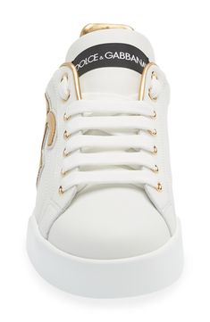 This street-smart leather sneaker kicks your casual ensembles up a notch with iconic logo detailing highlighted by a metallic finish. Lace-up style Removable insole Leather upper and lining/synthetic sole Made in Italy Women's Designer Shoes Sporty Low-top Sneakers With Logo Plaque, Luxury Lace-up Sneakers With Logo Detail, Sporty Lace-up Sneakers With Logo Plaque, Streetwear Lace-up Sneakers With Logo Plaque, Luxury Low-top Sneakers With Logo, Modern Low-top Sneakers With Logo Plaque, White Lace-up Sneakers With Logo Plaque, Designer Sneakers With White Sole And Embossed Logo, Designer Sneakers With Embossed Logo And White Sole