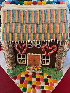 a gingerbread house decorated with candy and candies