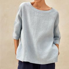 100% European Linen (Preshrunk) Top Pull-On Style That Is Casual Yet Sophisticated. It Has An Oversized Silhouette With Wide Round Neckline, Dropped Shoulders, Tailored 3/4 Sleeves, And A Slightly Arched Hem. Color Is A Light Blue. Machine Washable Gentle Cycle, Tumble Dry, Low Temperature Ironing Recommended. Equivalent To Size 12-14 Us, The Approximate Measurements Are: Shoulders: 32” Bust: 58.3” Ptp: 28.5” Waist: 56” Hips: 57” Overall Length: 24.25” Sleeve Length: 7.3” Condition Is New With T Relaxed Blue Blouse For Spring, Light Blue Crew Neck Blouse For Summer, Blue Solid Color Crew Neck Blouse, Light Blue Linen Casual Tops, Casual Light Blue Linen Tops, Plain Light Blue Tops For Spring, Light Blue Plain Tops For Spring, Relaxed Blue Summer Blouse, Simple Relaxed Fit Spring Tops