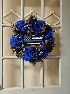 a blue wreath with an american flag on it