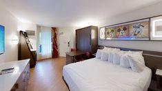 a hotel room with mickey mouse paintings on the wall