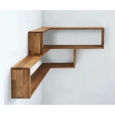 two wooden shelves on the side of a wall