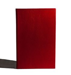 a red leather book with a black cover