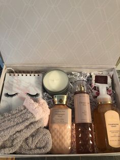 an open box containing three bottles of body care products