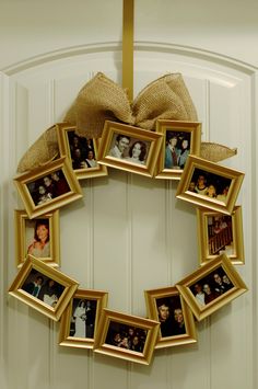 a wreath made out of pictures hanging on the front door with a bow around it