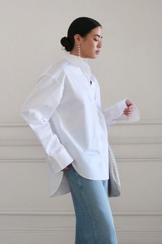 Oversized tailored shirt with drop shoulder. Box center pleat at back, with rounded hem and extended tail. Shell buttons. Oversized fit. Wear your normal size for an oversized fit or size down for a more traditional fit. Model is wearing a S. 100% cotton. Gentle machine wash cold, inside out, with like colors. Lay flat to dry. Oversized Button Down Shirt, Shell Buttons, Favorite Sweater, The Favorite, Oversized Fits, Drop Shoulder, Lay Flat, The Borrowers, Fashion Forward