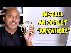 a man holding up a wii remote in front of a wall with the words install an outlet anywhere