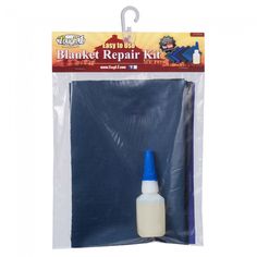 a bottle of paint with a blue cap on it's side in a plastic bag