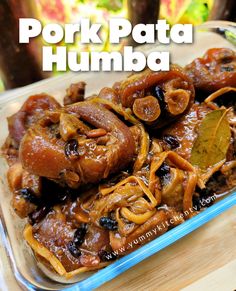 pork pata humba in a glass dish on a wooden table