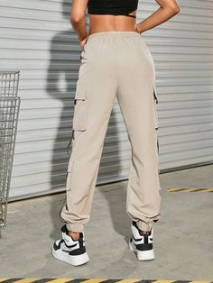 Are you ready for a casual adventure? Take on the town in style with our Drawstring Waist Letter Patched Flap Pocket Buckle Detail Cargo Pants! Made from high-quality polyester, these one-of-a-kind pants feature a drawstring waist, flap pockets, and buckle detail that'll have you ready to tackle anything that comes your way. So go ahead - put a little pep in your step and hit the streets in style. Specifications: Type: Cargo Pants Closure Type: Drawstring Waist Details: Drawstring, Patched, Pock Flap Pocket, Drawstring Waist, Cargo Pants, Buckle, High Quality, Pants, Trousers