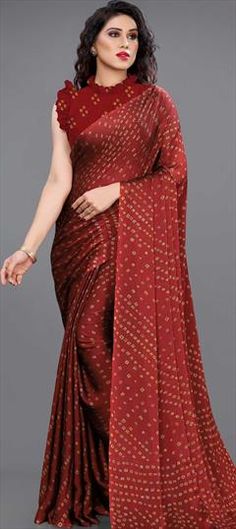 Red and Maroon color Saree in Georgette fabric with Bandhej, Printed work Red Art Silk Dupatta For Party, Red Bandhani Print Blouse Piece For Wedding, Fitted Red Bandhani Print Saree, Red Bandhani Print Dupatta For Party, Red Fabric With Pallu For Diwali, Festive Red Saree Fabric, Red Dupatta Fabric For Festive Occasions, Festive Red Dupatta Fabric, Festive Red Fabric With Pallu