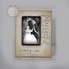 a wedding photo frame with the bride and groom's handwritten thank you for marriage