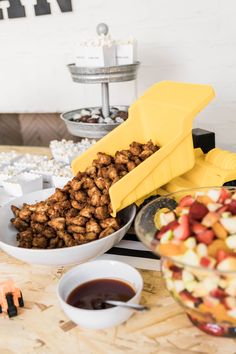 a table topped with bowls filled with food