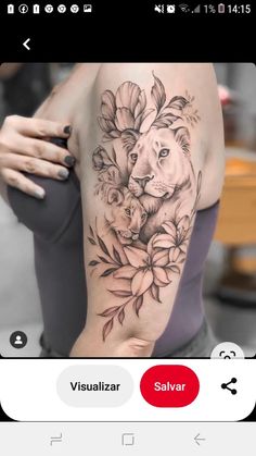 a woman's arm with a lion and flowers tattoo on the left side of her body