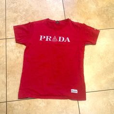 Used Size Extra Large Prada Polo Shirt, Prada T Shirts Women, Prada Shirts Women, Prada Tshirt, Prada Tshirt Men, Red Cotton Pop Culture T-shirt, Beautiful Tshirts, Prada Top, Prada